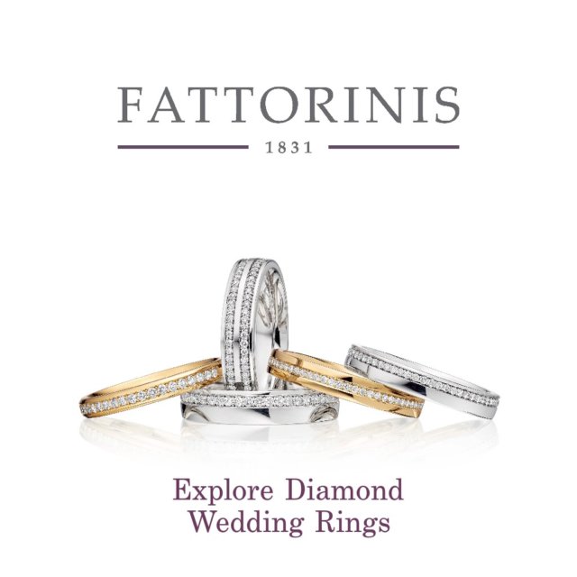 Pair of diamond-set wedding bands made up at Fattorinis, displayed on linen